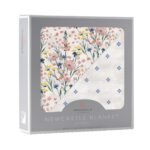 "Soft and luxurious baby blanket featuring a charming design of wildflowers and periwinkle diamond polka dots. Perfect for keeping your newborn snug and warm. Made from bamboo material for added comfort."