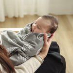 "Organic rainbow knit swaddle blankets for newborns, ensuring softness, comfort, and safety. A must-have nursery essential."