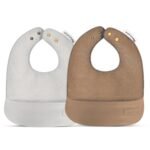 "High-quality Vegan Leather Bibs Set for Babies 0-12 Months - Stylish and eco-friendly bibs designed for eco-conscious parents. Easy to clean and gentle on baby's delicate skin."