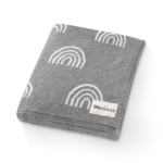 "Organic rainbow knit swaddle blankets for newborns, ensuring softness and safety. Perfect for cozy snuggles and peaceful sleep. ideal choice for new parents."